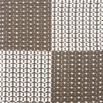 Indoor-Outdoor rug in a graphic checkerboard in white and brown.