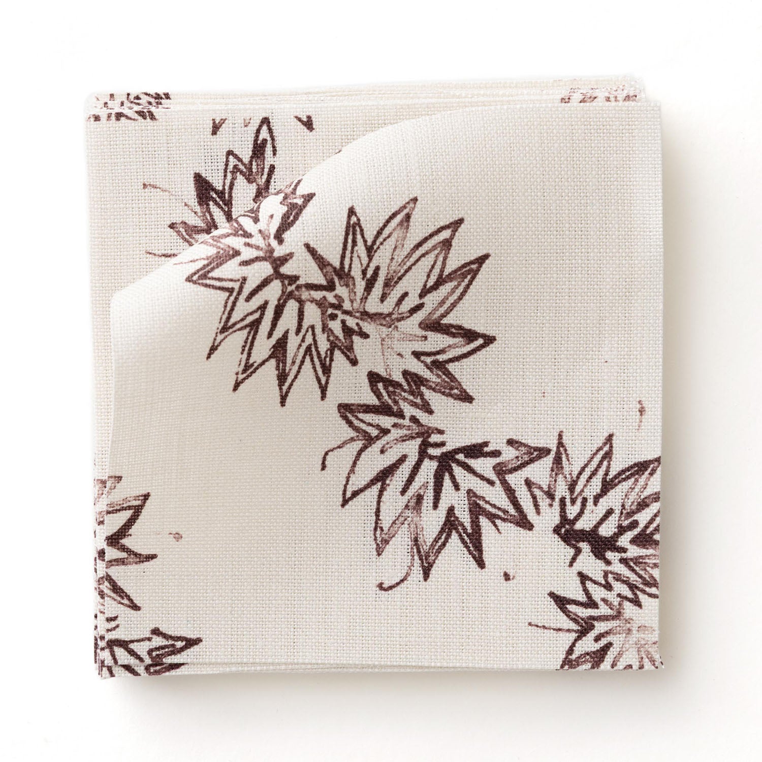 Fabric swatch with stripe pattern of stylized dark wine purple leaves on a beige background