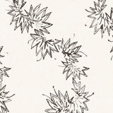 Detail of wallpaper with stripe pattern of stylized ink black leaves on a cream background