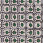Detail of fabric in a geometric lattice print in green, blue-gray and brown.