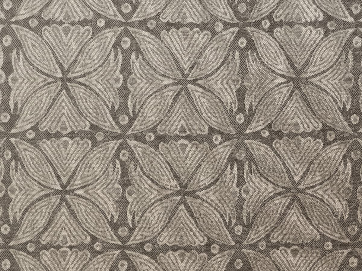 Detail of fabric in a botanical geometric print in shades of gray.