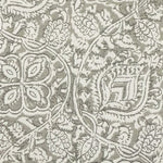 Detail of fabric in a painterly floral paisley in shades of light gray.