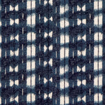 Detail of fabric in a textural shibori print in shades of navy on a greige field.