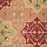 Decorative rug with geometric pattern in red, beige, and brown