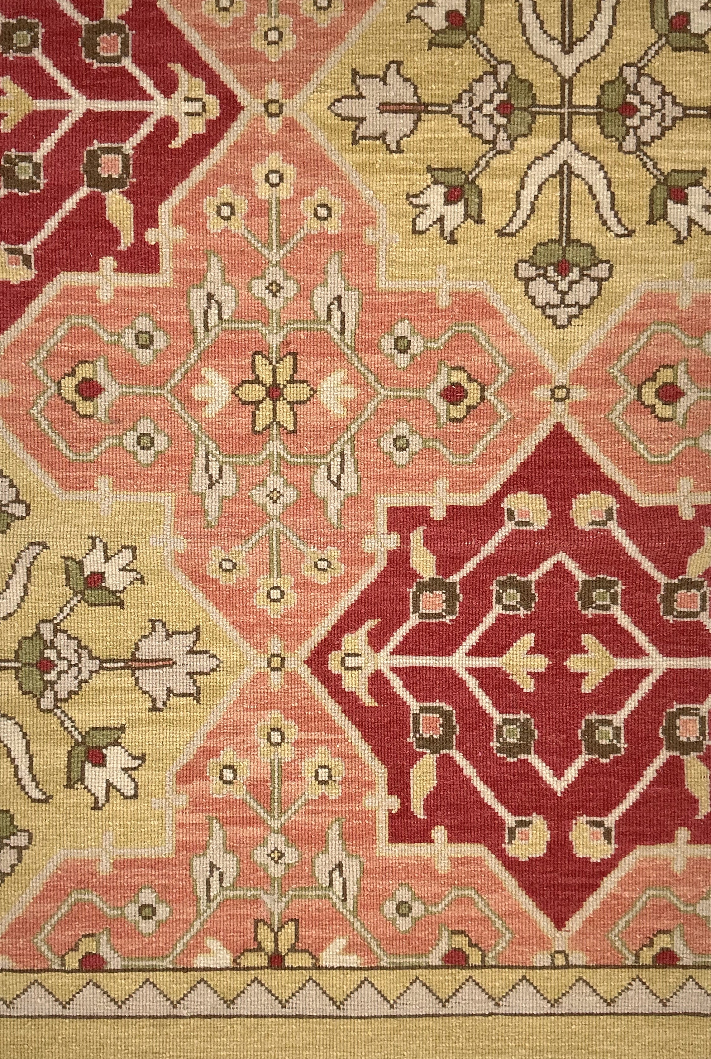 Decorative rug with geometric pattern in red, beige, and brown