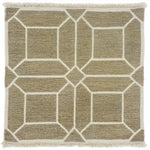 Woven rug swatch with a ivory lattice pattern on a taupe field with ivory fringe edges at top and bottom