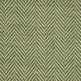 Handwoven rug in herringbone pattern in green and white. 
