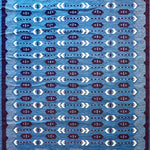 Handwoven rug in a Swedish arrow design in brown and white on a green field. 