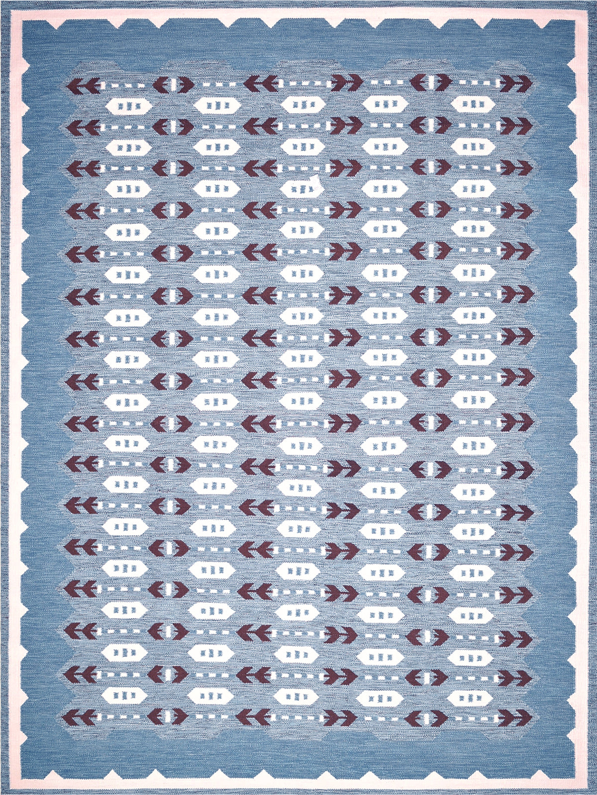 Handwoven rug in a Swedish arrow design in brown and white on a green field. 