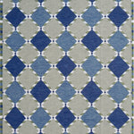 Handwoven rug in a Swedish diamond lattice design shades of green and blue with white accents. 