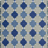 Handwoven rug in a Swedish diamond lattice design shades of green and blue with white accents. 