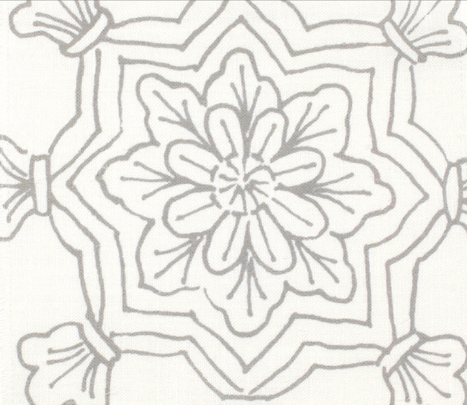 Detail of fabric in a floral medallion print in gray on a white field.
