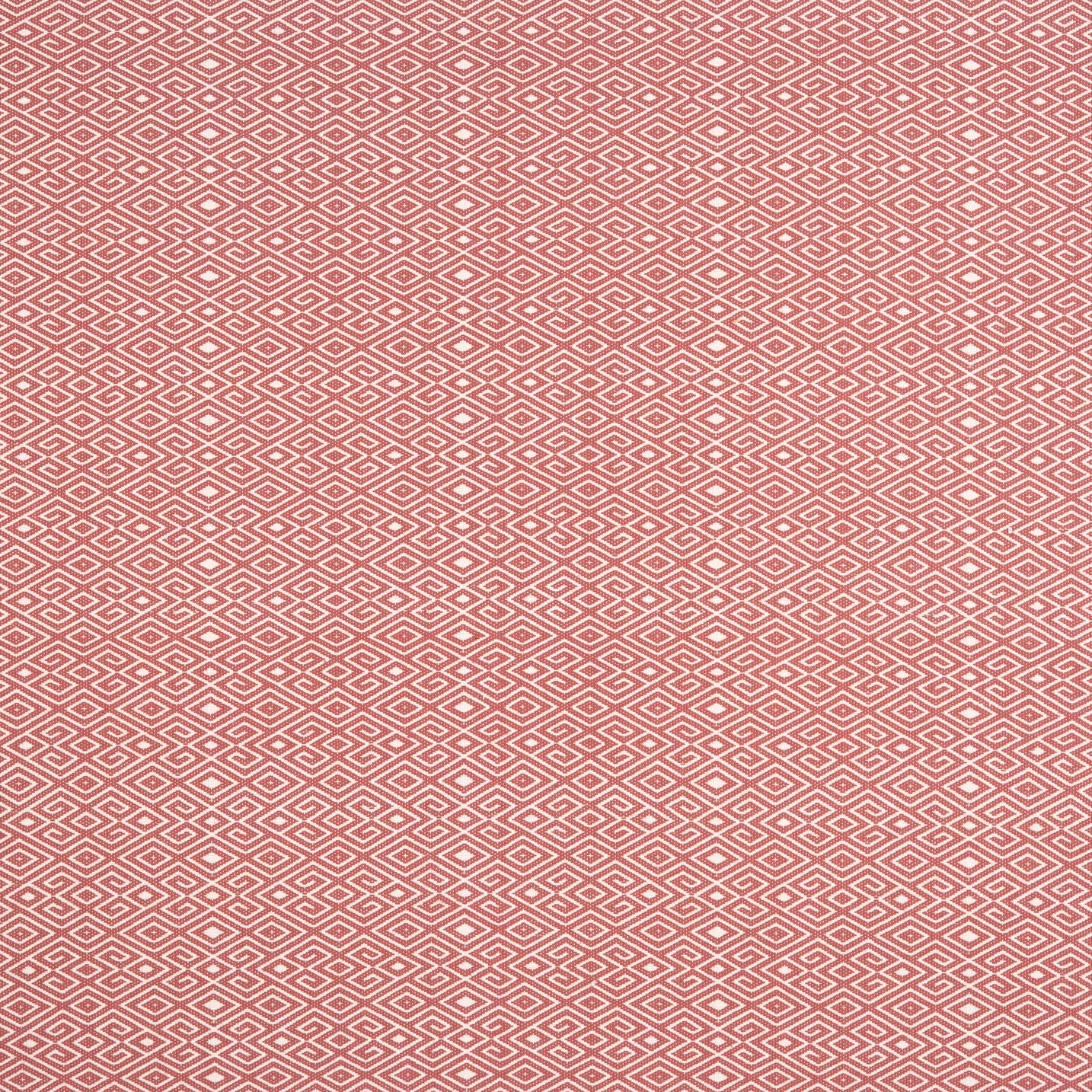 Patterned fabric swatch with a geometric design on a red background
