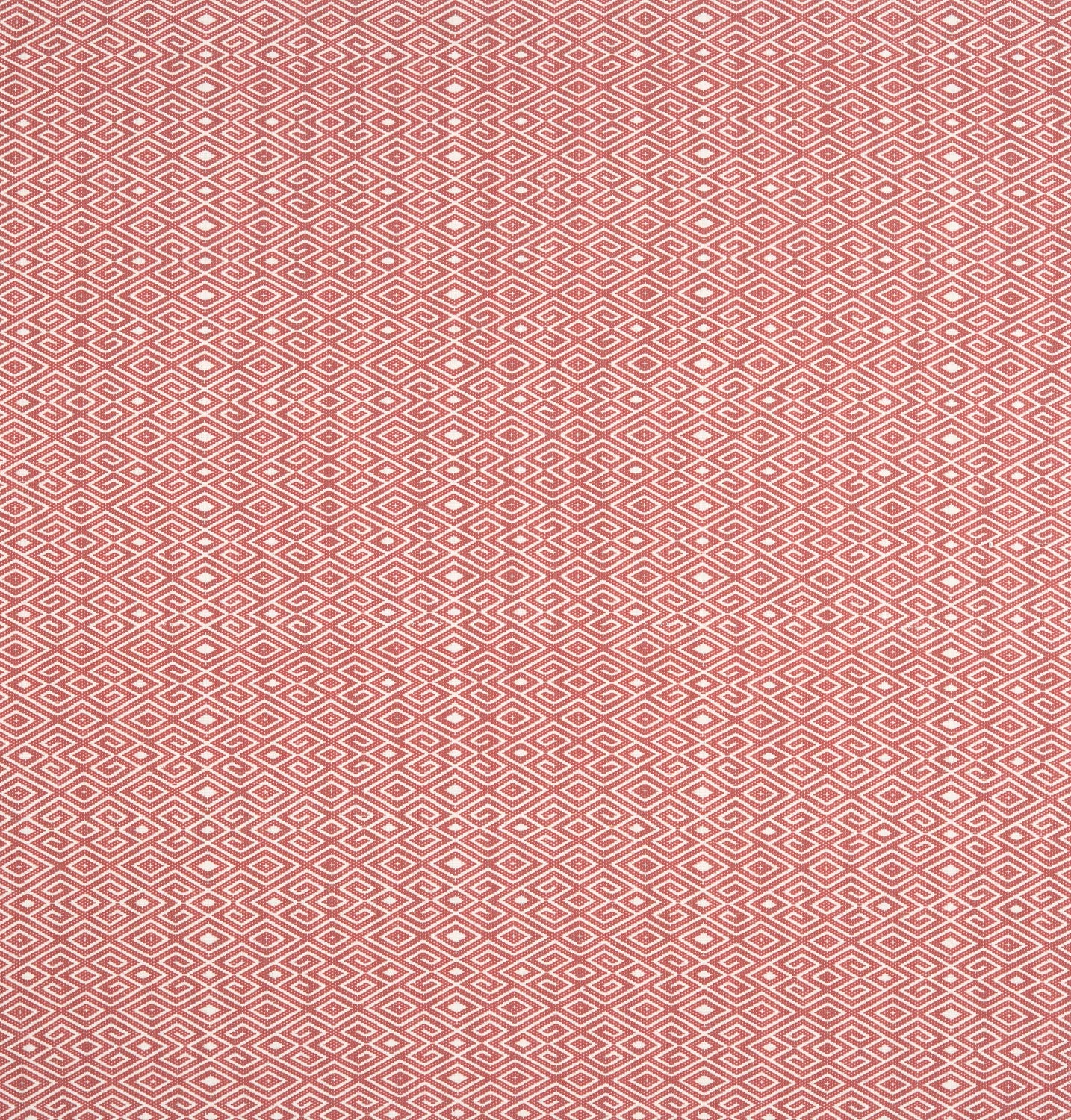 Patterned fabric swatch with a geometric design on a red background