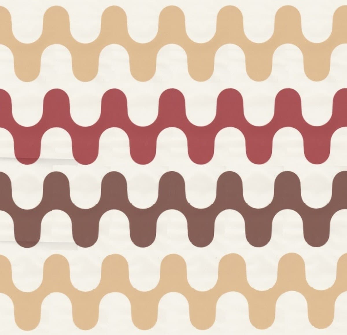 Detail of wallpaper in a playful curving stripe print in shades of yellow, red and orange on a white field.