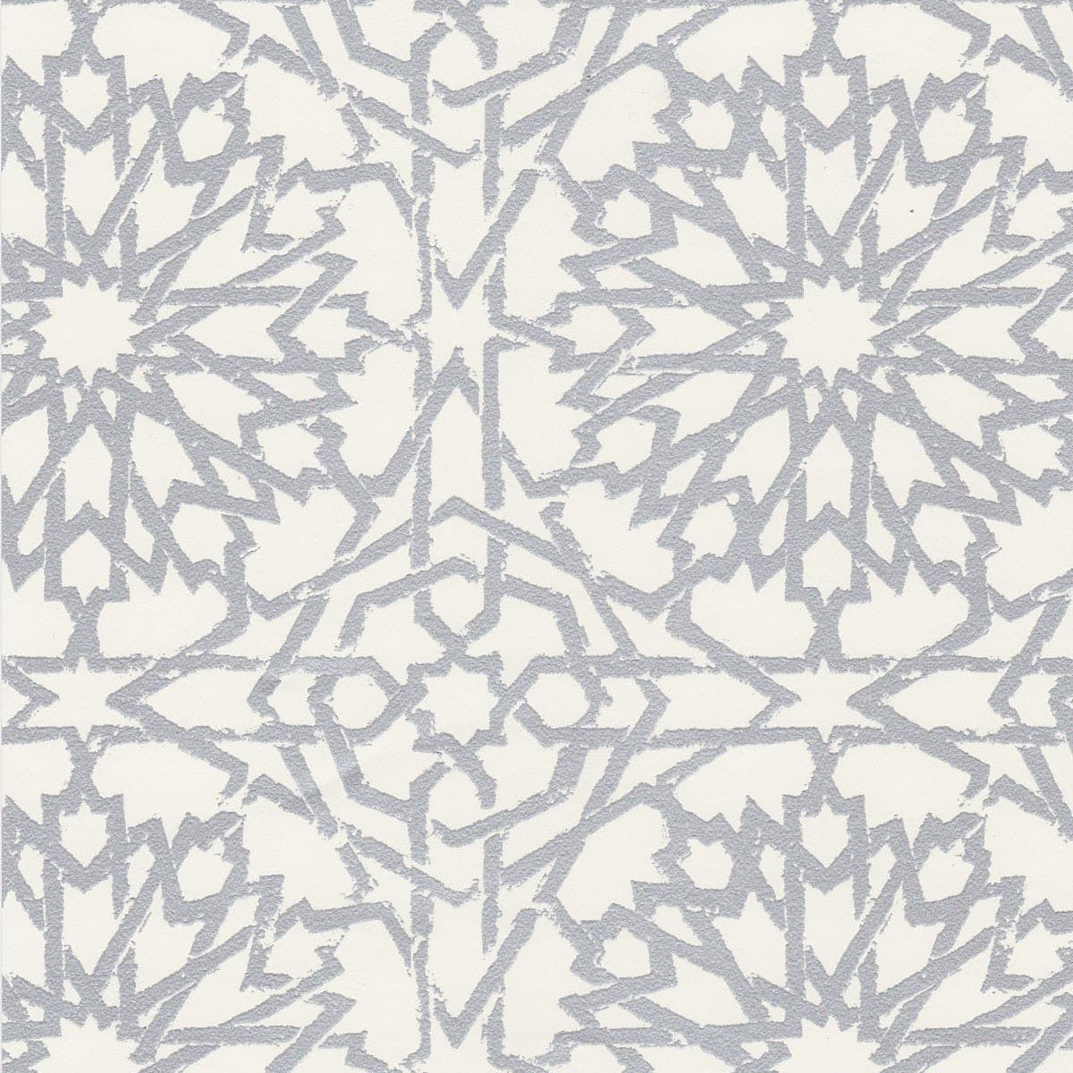 Detail of wallpaper in a small-scale lattice print in metallic gray on a white field.
