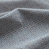 Close-up of textured fabric with geometric pattern in blue 