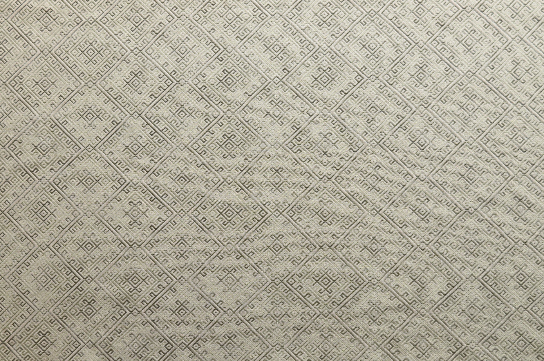 Textured beige fabric with a diamond pattern