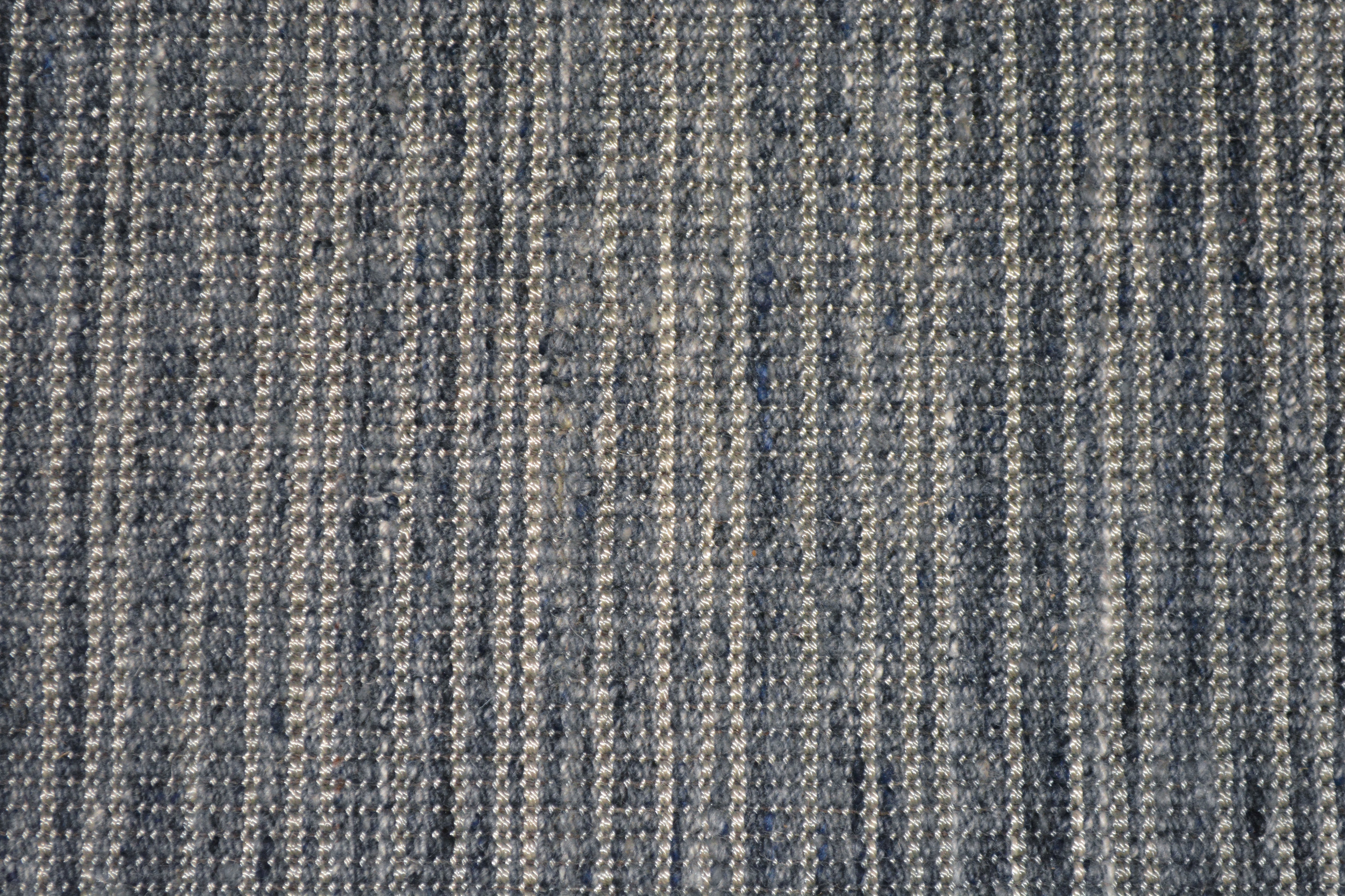 Textured broadloom carpet in slate blue.