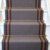 Striped flatweave runner in grey taupe and red on white staircase
