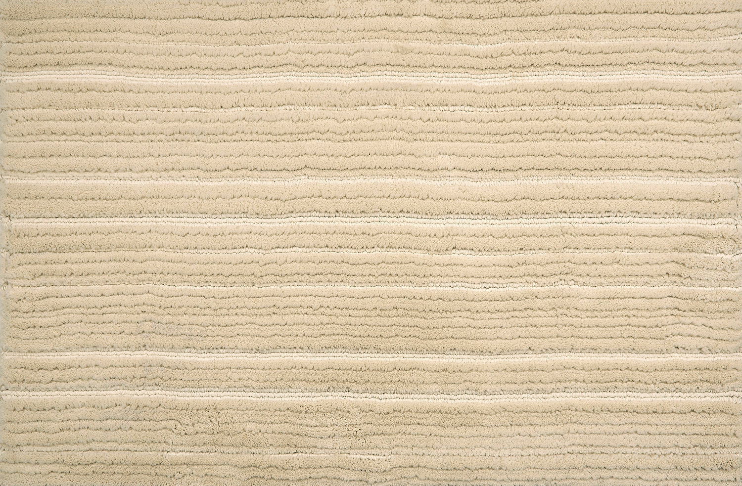 Broadloom carpet with ribbed and cut pile stripe in cream.