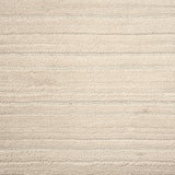 Broadloom carpet with ribbed and cut pile stripe in ivory.