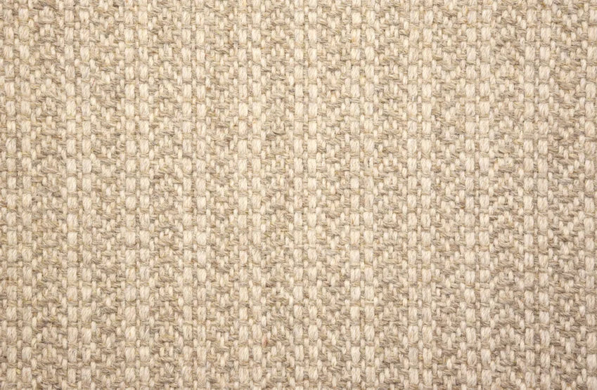 Broadloom carpet swatch in a herringbone pattern in a tan design
