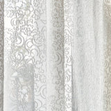 Draped sheer fabric in lace inspired botanical pattern in ivory.