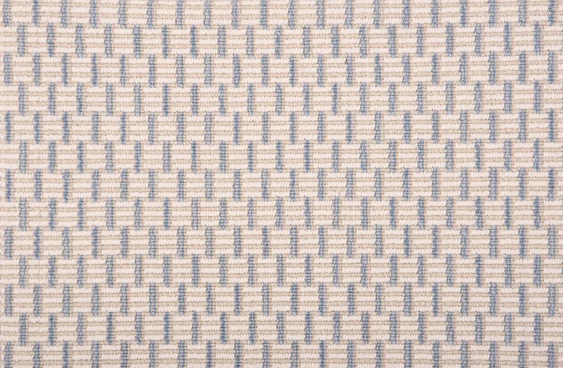 Broadloom carpet in a small striped check in light blue and ecru.