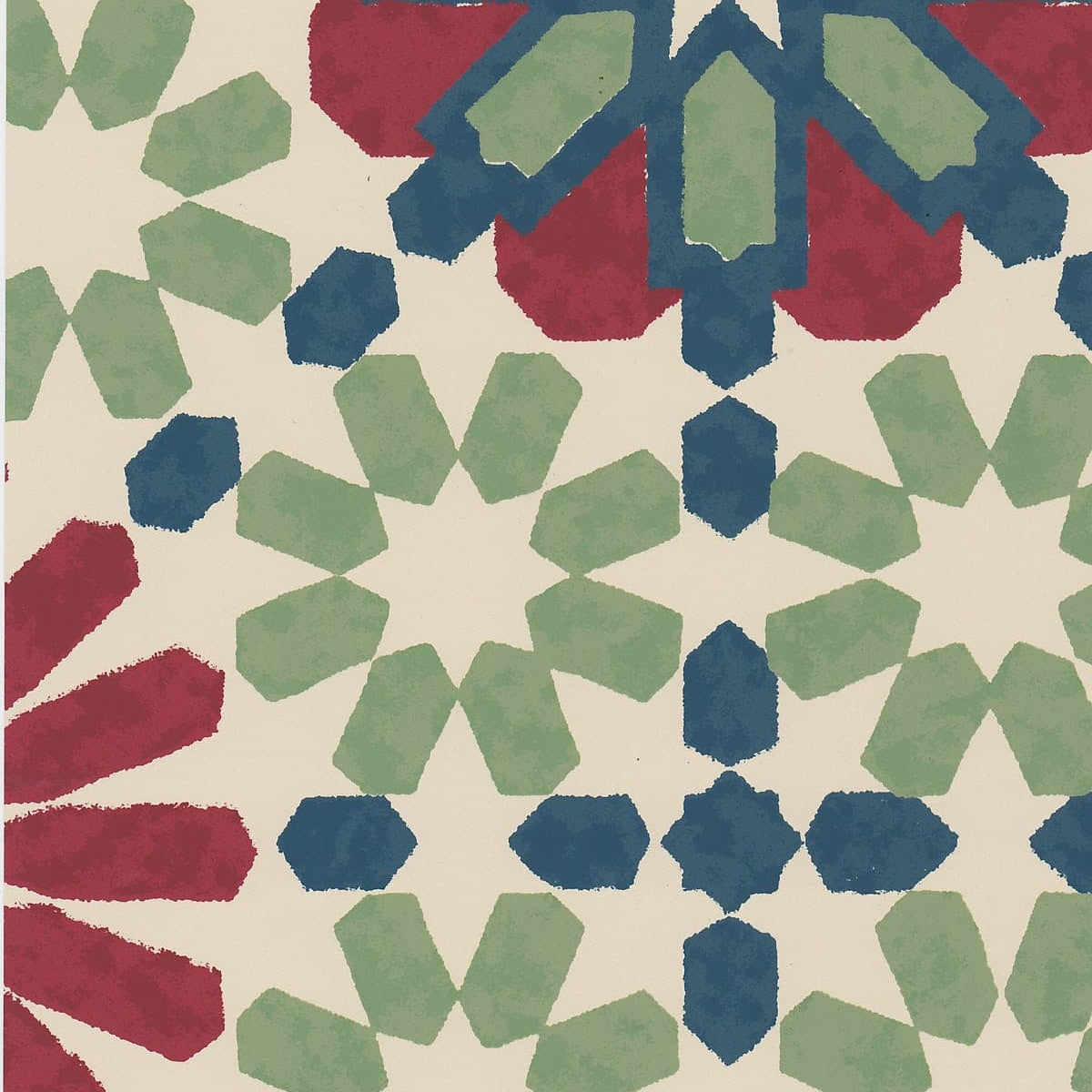 Detail of wallpaper in a geometric lattice print in shades of red, blue and green on a cream field.