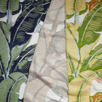 Gently draped fabric cuttings in a vintage banana leaf print in various colors.