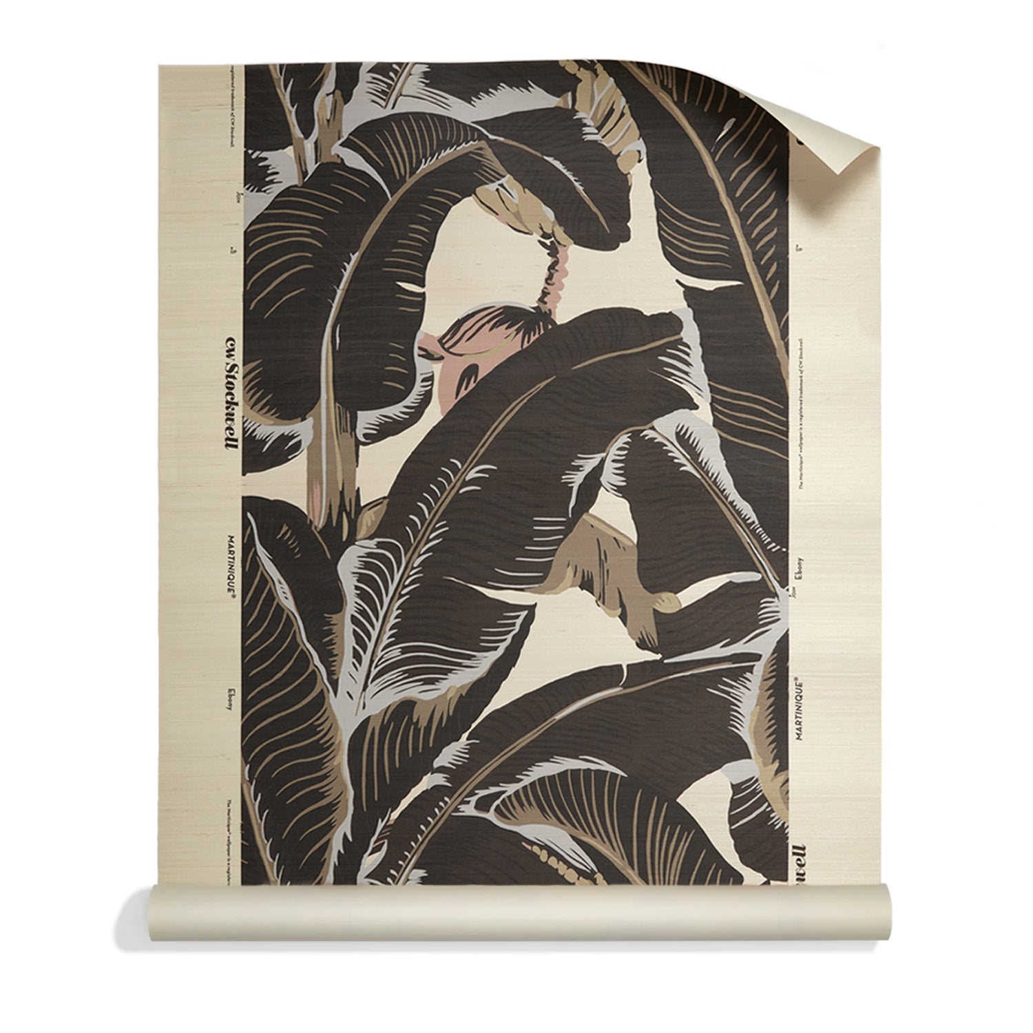A roll of banana leaf pattern grasscloth featuring large tropical leaves in dark brown, beige, and cream on a light background.