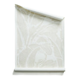 Roll of wallpaper with bold high contrast tropical banana leaf pattern in white on ecru.
