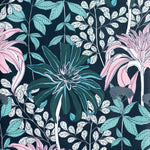 Detail of wallpaper in a floral print in pink, green and blue on a navy field.