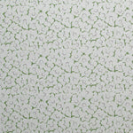 Fabric in a minimal floral print in purple and green on a gray field.