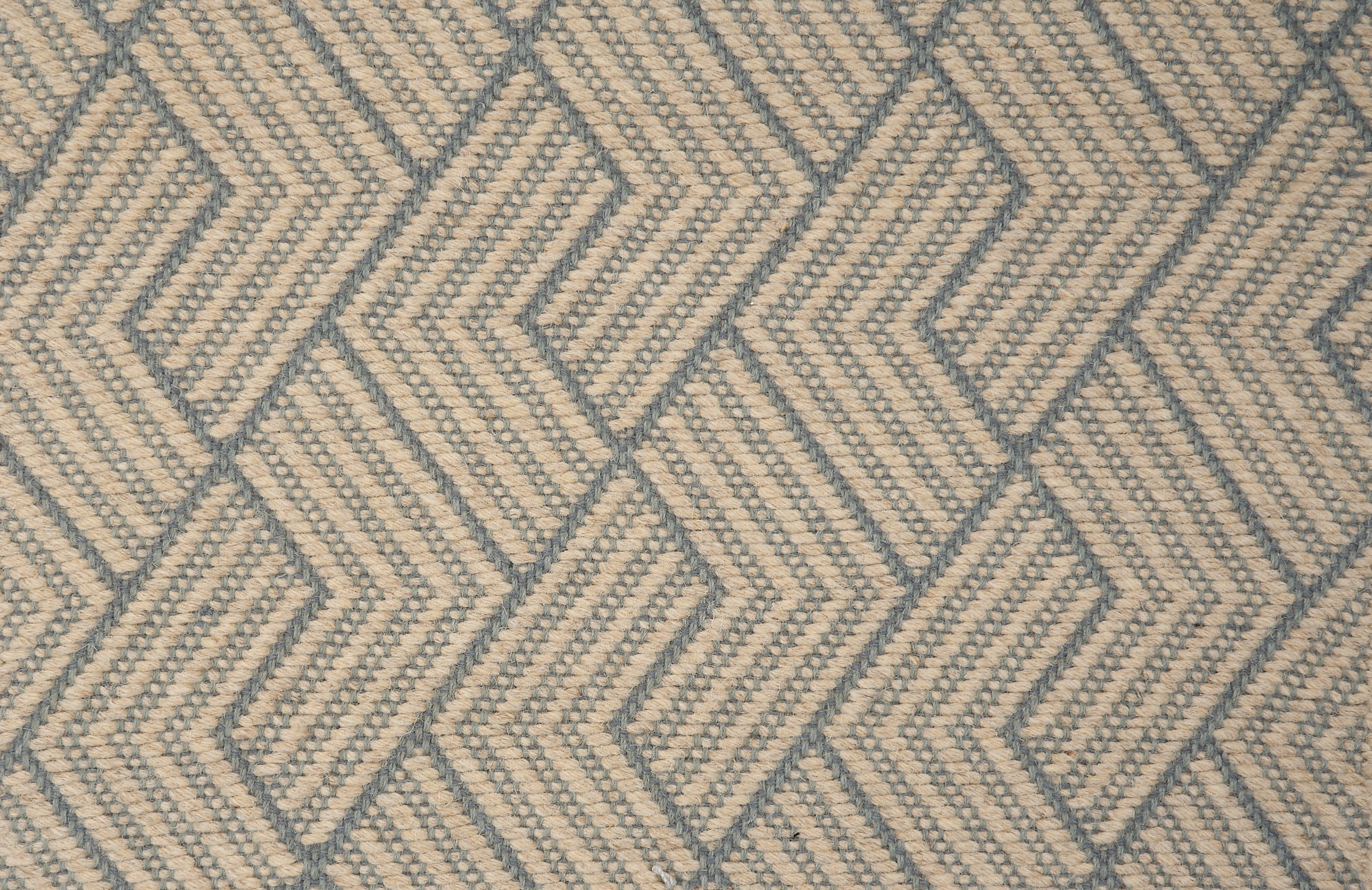 Broadloom carpet in a novel herringbone design in taupe and sky blue