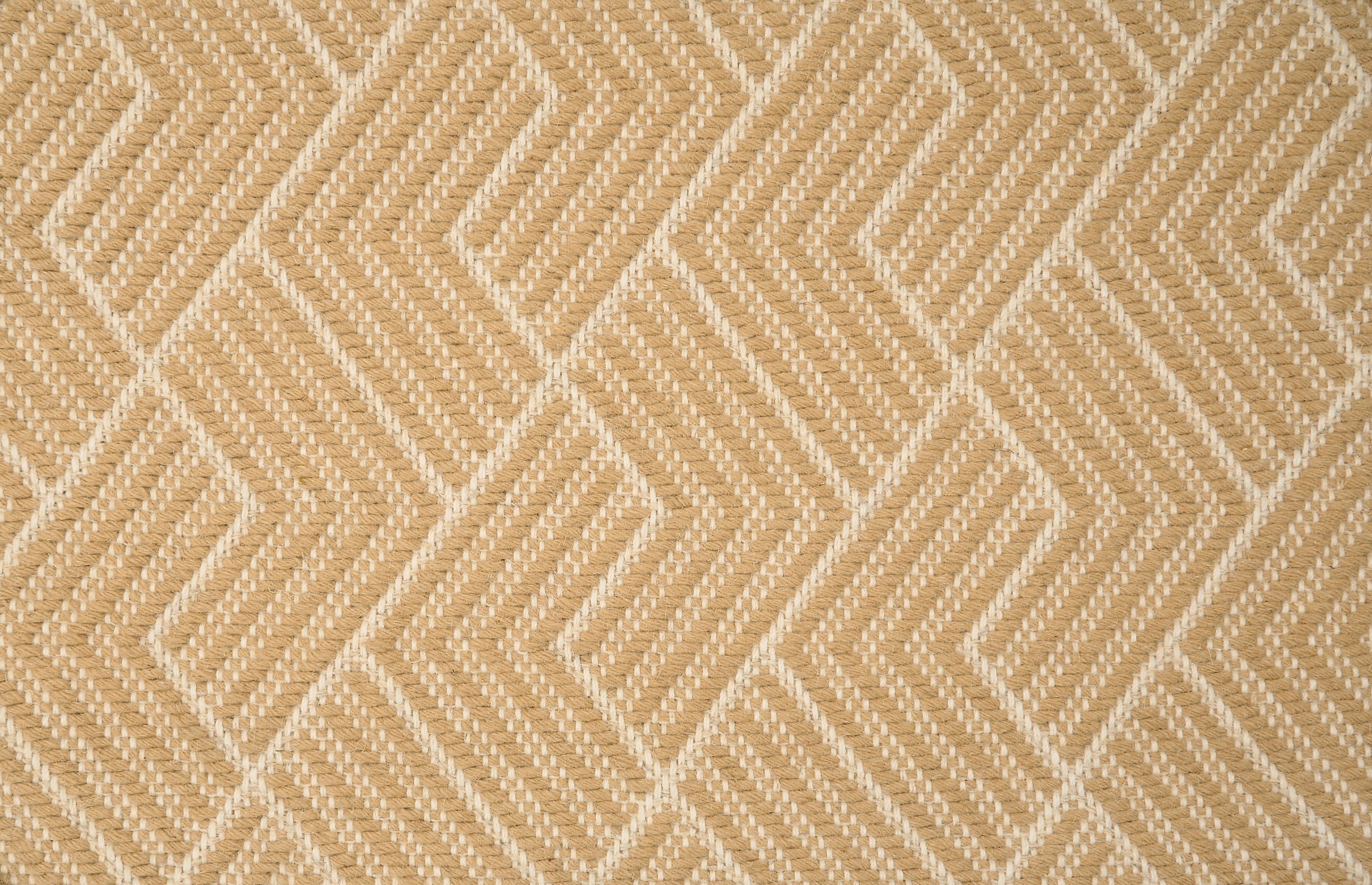 Broadloom carpet in a novel herringbone design in cream and tan.