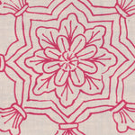 Detail of fabric in a floral medallion print in pink on a cream field.