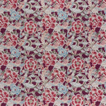 printed linen fabric in a painterly floral pattern in shades of blue, green and pink on a maroon field.