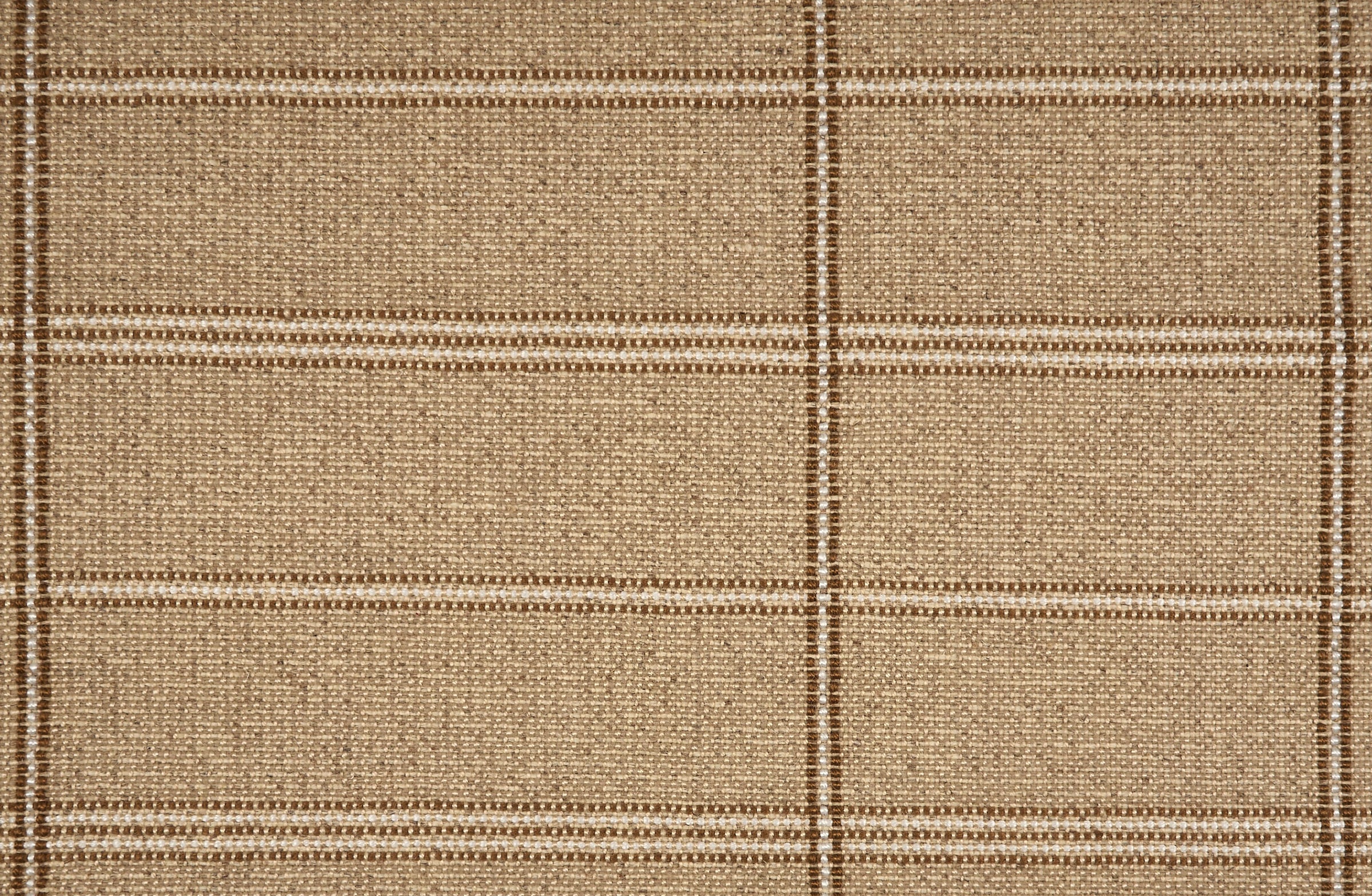 Broadloom carpet in large scale plaid in shades of brown and ivory.