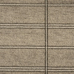 Broadloom carpet in large scale plaid in shades of grey and taupe.