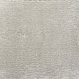 Broadloom carpet in cut pile in cool white. 