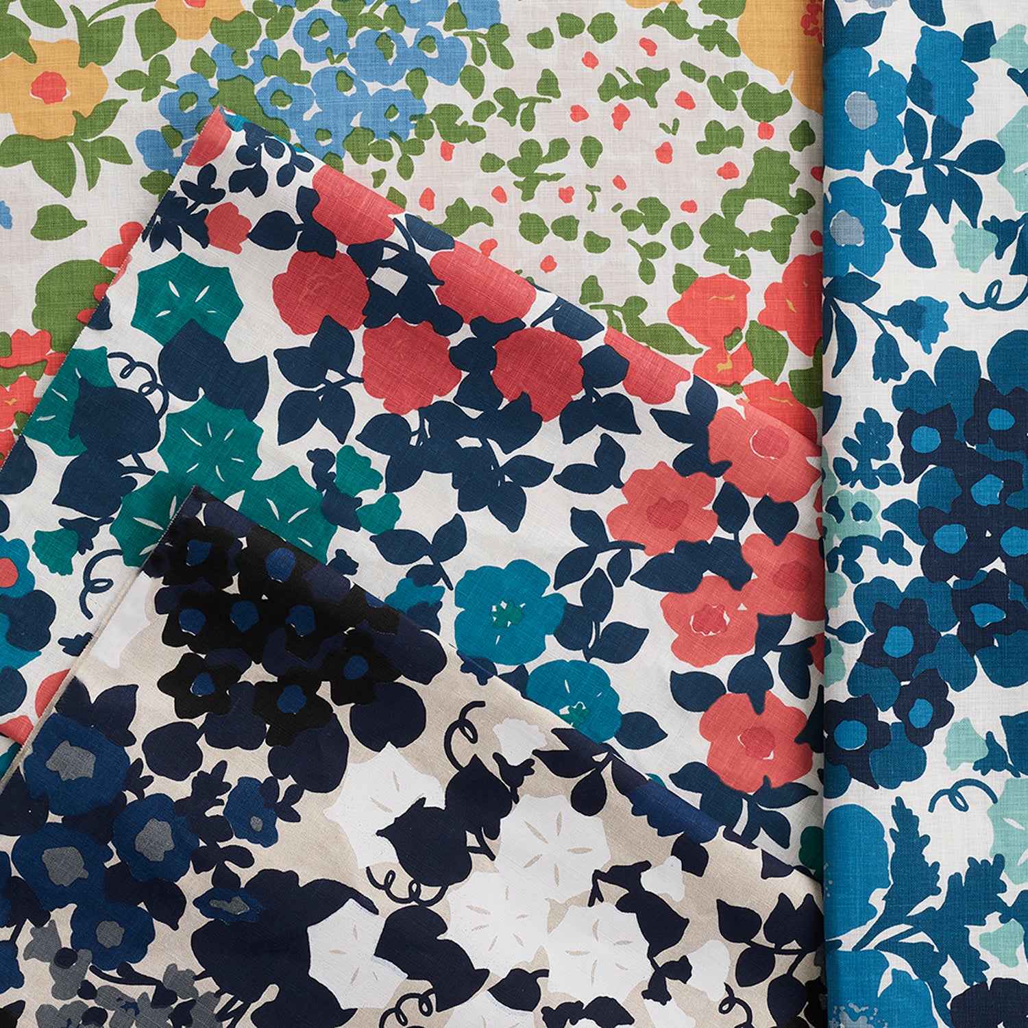 Gently draped fabric cuttings with a retro floral pattern in various colors