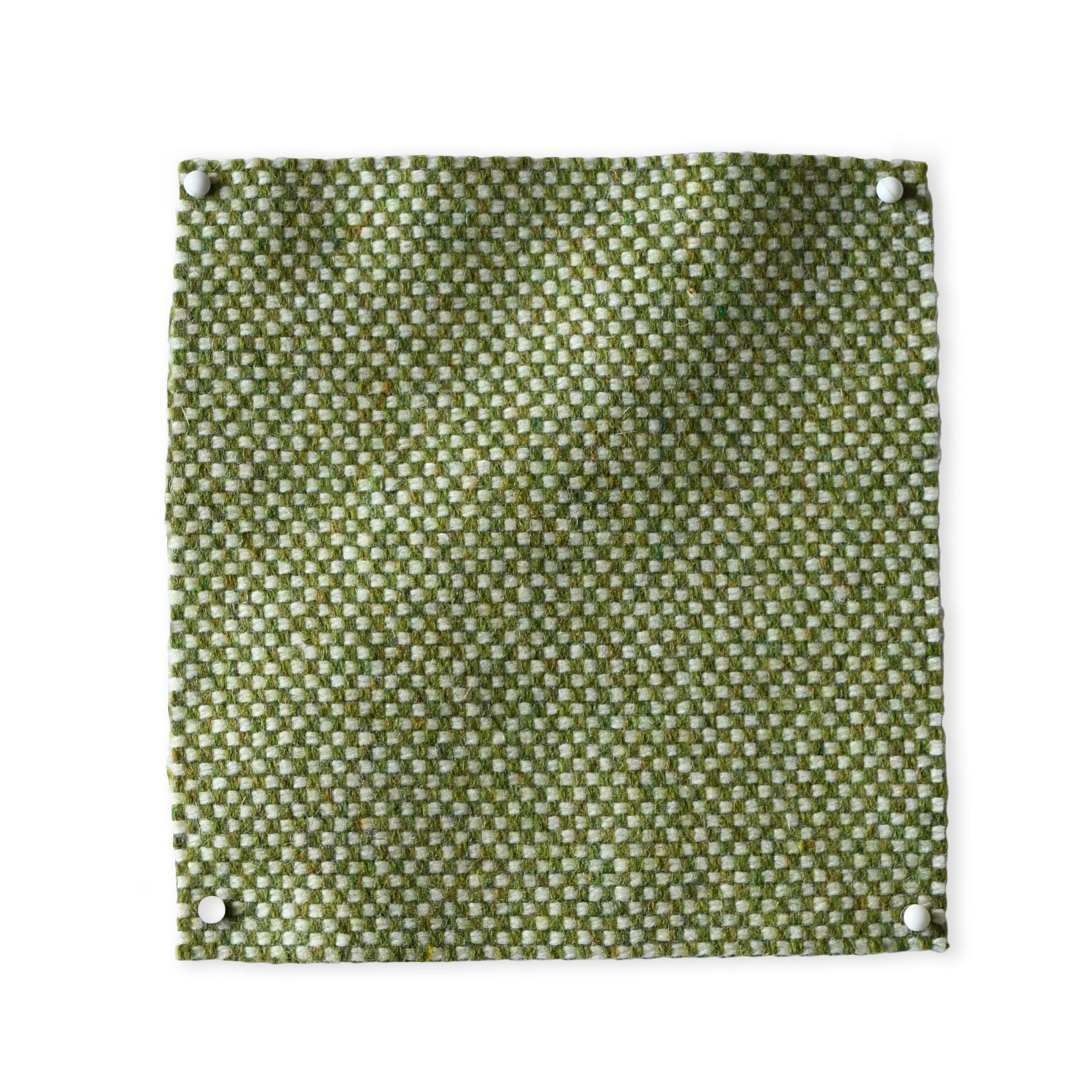 Pinned swatch of woven fabric in green.