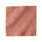 Pinned swatch of woven fabric in orange.