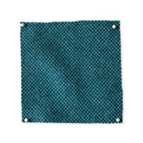 Pinned swatch of woven fabric in teal