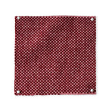 Pinned swatch of woven fabric in red. 