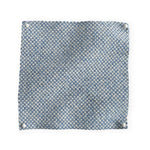 Pinned swatch of woven fabric in pale blue. 