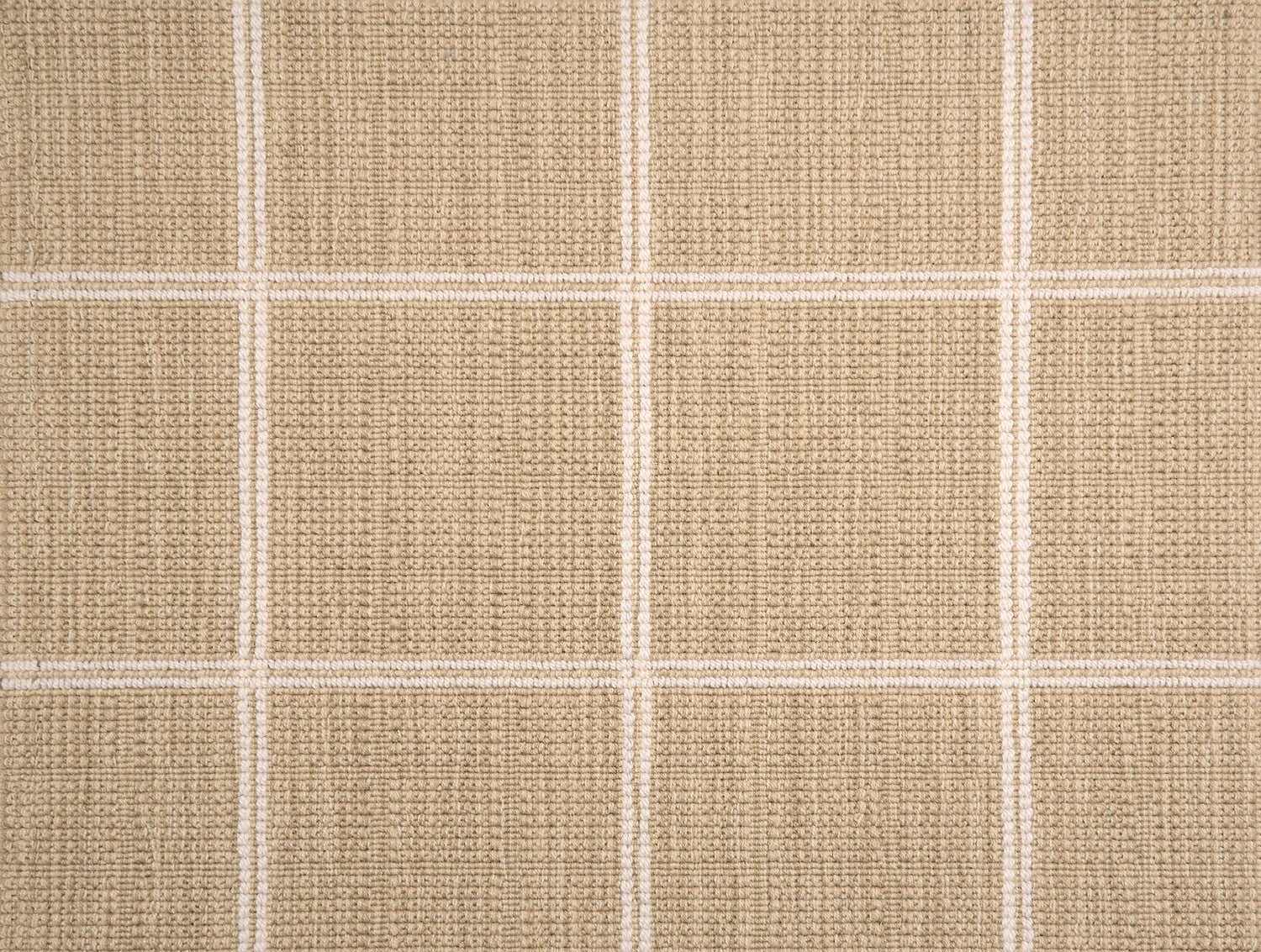 Broadloom carpet sample with windowpane grid in cream on tan background. 