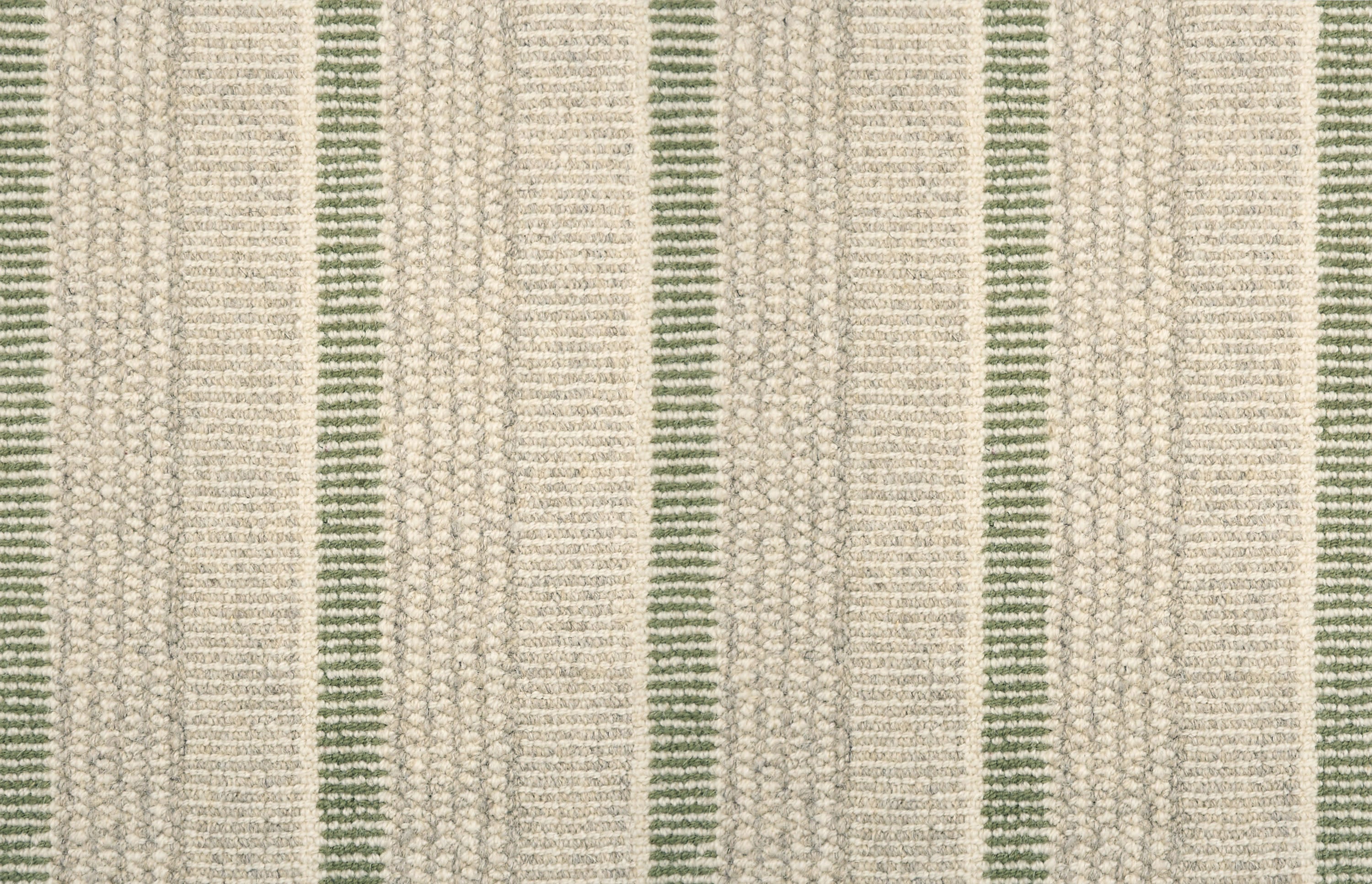 Textured broadloom carpet in ecru with stripes in green.